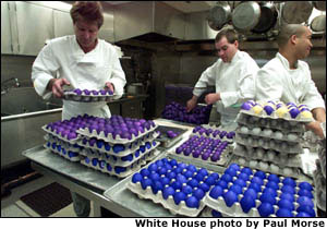 White House chefs arrange some of the thousands of dyed eggs in preparation for the annual Easter Egg Roll on the South Lawn of the White House on April 1, 2002. White House Photo by Paul Morse.