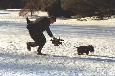 Whether inside the White House or outside on the South Lawn, keeping up with the spirited Scottish Terrier was a challenge for the camera crew of the Barney Cam, Monday, Dec. 9, 2002. 