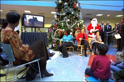 Laura Bush hosts the annual Christmas program at the Children's National Medical Center Thursday, Dec. 12, 2002 in Washington, D.C. During the program Mrs. Bush debuted a video of Barney's tour of the White House Christmas decorations. 