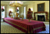 Cheerful garlands and bright sprays of greenery decorate the mantel and cascade from wall sconces in the State Dining Room. Ed and Cindy Hedlund and their son Thomas, of Hedlund Christmas Farm in Elma, Washington presented this year's 18-foot noble fir to President George W. Bush and wife Laura Bush. 