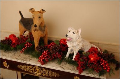 Caroline Kennedy's dog, Pushinka ("fluffy" in Russian), a gift from Soviet Premier Nikita Khrushchev, is making friends with Laddie Boy, President Warren Harding's Airedale terrier. Laddie Boy sat in his own chair during cabinet meetings and once invited all the neighborhood dogs to his birthday party. President Harding served from 1921 to 1923.