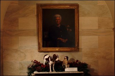 Millie, the beloved English springer spaniel of President George H.W. Bush and Barbara Bush, and her female puppy, Spot, greet guests along the ground floor corridor of the White House. During Millie's first few months of living in the White House, she gave birth to Spot and five others. Spot grew up in Texas with George W. and Laura Bush and their twin daughters. President George H.W. Bush served from 1989 to 1993.