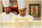 Thaddeus DuBois, Head Pastry Chef, inspects the roof on top of the official White House gingerbread house.