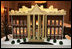 The White House gingerbread house, created by White House Executive Pastry Chef Thaddeus DuBois, is seen on display in the State Dining Room. 