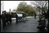 Laura Bush welcomes the arrival of the official White House Christmas tree delivered Monday, Nov. 28, 2005 on a horse drawn wagon. This year's tree, which will be displayed in the Blue Room of the White House, was donated by the Deal Family of Laurel Springs, N.C.