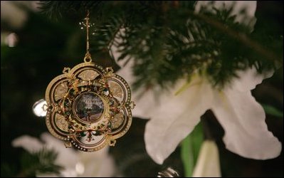 The 2005 White House Christmas ornament is seen hanging Wednesday, Nov. 30, 2005 on the White House Christmas Tree, a Fraser Fir, in the Blue Room of the White House.