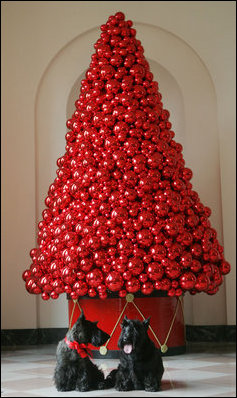 Barney and Miss Beazley pose beneath a decorative red ornament Christmas Tree, Wednesday, Nov. 29, 2006, in the East Wing of the White House.