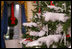 Crystal ornaments, red ribbons and make-believe snow decorate the official White House Christmas tree in the Blue Room of the White House, Wednesday, Nov. 29, 2006, an 18-foot Douglas fir tree donated by the Crystal Springs Tree Farm of Lehighton, Pa. 