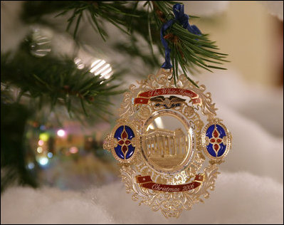 A White House Christmas ornament hangs from a branch on the official White House Christmas tree Wednesday, Nov. 29, 2006, an 18-foot Douglas fir on display in the Blue Room of the White House. 