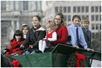 Members of the Botek family of Lehighton, Pa., ride the horse-drawn wagon delivering the official White House Christmas tree Monday, Nov. 27 , 2006, an 18-foot Douglas fir tree donated by the Botek family, owners of the Crystal Springs Tree Farm in Lehighton, Pa. 