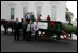 Mrs. Laura Bush stands with the Botek family of Lehighton, Pa., as she receives the official White House Christmas tree on the North Portico Monday, Nov. 27, 2006. The Botek family owns the Crystal Springs Tree Farm and donated the 18-foot Douglas fir tree. 