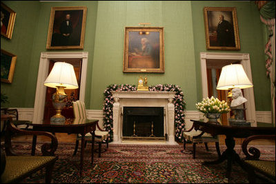 Red and white peppermint treats are hung on the garland on the mantle in the always seasonal Green Room. Approximately 1,089 feet of garland were used in decorating the White House this year.