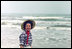 Mrs. Lady Bird Johnson wades in the surf at Padre Island National Seashore, Texas, 1968. Courtesy Lyndon B. Johnson Presidential Library