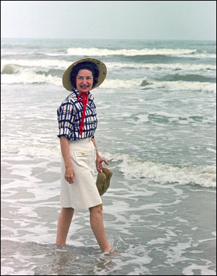 Mrs. Lady Bird Johnson wades in the surf at Padre Island National Seashore, Texas, 1968. Courtesy Lyndon B. Johnson Presidential Library