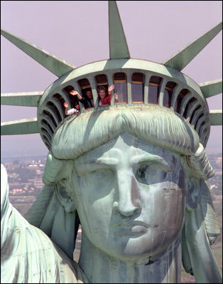 Mrs. Nancy Reagan waves from the Statue of Liberty National Monument, New York City, 1986. Courtesy Ronald Reagan Presidential Library