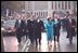 President George W. Bush and Laura Bush wave as they walk down Pennsylvania Avenue during the Inaugural Parade in Washington, D.C., Jan. 20, 2001.