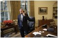 Standing at his desk in the Oval Office, President George W. Bush receives a phone call from Democratic presidential candidate John Kerry in which the senator conceded defeat in the 2004 presidential election Nov. 3, 2004.