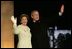 President George W. Bush and Laura Bush arrive on stage for a fireworks display during the inaugural concert 'A Celebration of Freedom' on the Ellipse south of the White House, Wednesday, Jan. 19, 2005.