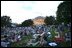 Awaiting a show of explosions of color, White House staff members and their families relax on the South Lawn Thursday, July 4. Shortly before the fireworks began, President Bush joined the party and watched the display from the Truman Balcony.