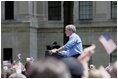 President George W. Bush delivers remarks at the Fourth of July Celebration in Charleston, West Virginia on Independence Day, 2004.