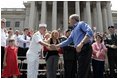 President George W. Bush greets the crowd at the Fourth of July Celebration on the steps of the Capitol in Charleston, West Virginia on Independence day, 2004.