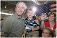 President George W. Bush poses for photos during his visit Wednesday, July 4, 2007, with members of the West Virginia Air National Guard 167th Airlift Wing and their family members in Martinsburg, W. Va. White House photo by Chris Greenberg