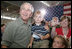 President George W. Bush poses for photos during his visit Wednesday, July 4, 2007, with members of the West Virginia Air National Guard 167th Airlift Wing and their family members in Martinsburg, W. Va. White House photo by Chris Greenberg