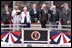 President George W. Bush joins fellow veterans in standing at attention during the playing of the National Anthem at the dedication of the National D-Day Memorial in Bedford, Va., June 6, 2001. The memorial was built to honor those who served and died during Operation Overlord in the D-Day invasion at Normandy, France, June 6, 1944.