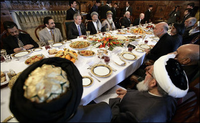 President George W. Bush and President Hamid Karzai of Afghanistan share a working lunch Wednesday, March 1, 2006, at the Presidential Palace in Kabul during a stop by President Bush en route to India.