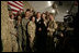 President George W. Bush poses for photos with U.S. and Coalition troops Wednesday, March 1, 2006, during a stopover at Bagram Air Base in Afghanistan, prior to his visit to India and Pakistan.