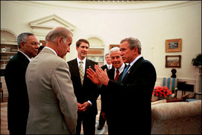 President Bush discusses the HIV/AIDS Bill with, from left, Secretary of State Colin Powell, and Senators Joseph Biden, Bill Frist and Richard Lugar in the Oval office May 8, 2003.