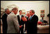 President Bush discusses the HIV/AIDS Bill with, from left, Secretary of State Colin Powell, and Senators Joseph Biden, Bill Frist and Richard Lugar in the Oval office May 8, 2003.