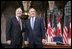 Before a bilateral session at Parliament Hill, President George W. Bush and Canadian Prime Minister Paul Martin meet in the rotunda in Ottawa, Canada, Nov. 30, 2004.