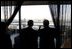 President George W. Bush looks at the cityscape with Canadian Prime Minister Paul Martin during a lunch meeting in Ottawa, Canada, Nov. 30, 2004. 