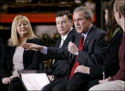 President George W. Bush speaks on stage during a conversation on the economy at SRC Automotive in Springfield, Mo., Monday, Feb. 9, 2004.