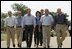 After talking with the press, President George W. Bush walks with his economic advisors at his ranch in Crawford, Texas, Aug. 13, 2003. Pictured are, from left, Director of the Office of Management and Budget Josh Bolten, Assistant to the President for Economic Policy Stephen Friedman, Secretary of Commerce Don Evans, Secretary of Labor Elaine Chao and Secretary of the Treasury John Snow. 