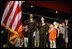 President George W. Bush and Education Secretary Rod Paige recite the "Pledge of Allegiance" with students at the East Literature Magnet School in Nashville, Tenn., Sept. 17, 2002. Committed to educational excellence in America, the President and Mrs. Bush launched programs such as "No Child Left Behind," "Ready to Read, Ready to Learn," and "Reading First." Education is a priority issue for them. Reaching out to share their vision, they have made it a practice to visit schools across the nation to meet one on one with teachers and students. 