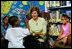 Laura Bush answers questions from a little boy during her reading of "Book, Book, Book" at the Chattanooga-Hamilton Bicentennial Library in Chattanooga, Tenn., June 20, 2003.