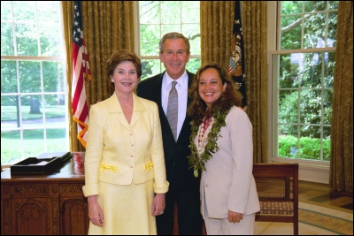 President George W. Bush and Laura Bush congratulate 2003 Maine Teacher of the Year Roberta R. Zarbaugh in the Oval Office Wednesday, April 30, 2003. White House Photo by Eric Draper