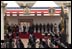 President George W. Bush and Laura Bush listen to the playing of America's national anthem during an official welcome ceremony at Buckingham Palace in London, Wednesday, Nov. 19, 2003. Standing with them are Her Majesty Queen Elizabeth and Prince Philip, Duke of Edinburgh. The President and Mrs. Bush last visited Buckingham Palace July of 2001. White House photo by Paul Morse