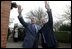 President George W. Bush and Prime Minister Tony Blair wave to onlookers during the President's visit to the Blair's home. White House photo by Eric Draper