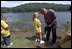 During a visit to Oak Mountain State Park, President Bush confers with a young YMCA day camper June 21, 2001.