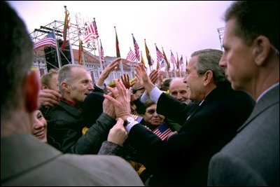 President George W. Bush greets Lithuanians in person at the Rotuse Square in the center of Vilnius, Lithuania, Nov. 23, 2002. 'This is a great day in the history of Lithuania, in the history of the Baltics, in the history of NATO, and in the history of freedom,' said President Bush in his remarks. 'And I have the honor of sharing this message with you: We proudly invite Lithuania to join us in NATO, the great Atlantic Alliance.' White House photo by Paul Morse