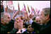 President George W. Bush greets Lithuanians in person at the Rotuse Square in the center of Vilnius, Lithuania, Nov. 23, 2002. 'This is a great day in the history of Lithuania, in the history of the Baltics, in the history of NATO, and in the history of freedom,' said President Bush in his remarks. 'And I have the honor of sharing this message with you: We proudly invite Lithuania to join us in NATO, the great Atlantic Alliance.' White House photo by Paul Morse