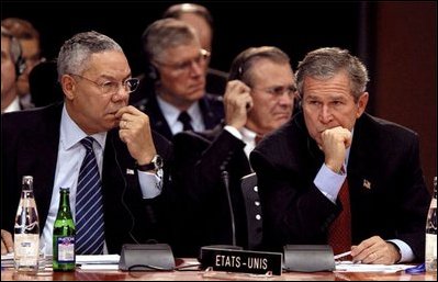 President George W. Bush and Secretary of State Colin Powell attend the North Atlantic Council Summit in Prague, Czech Republic, Nov. 21, 2002. White House photo by Paul Morse