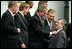 Preparing for a group photo at the NATO Summit, President George W. Bush jokes with Luxembourg's Prime Minister Jean-Claude Juncker at the Prague Congress Centre in Prague, Czech Republic, Nov. 21, 2002. Also pictured are, from left to right, Canadian Prime Minister Jean Chretien, Belgian Prime Minister Guy Verhofstadt, and Poland's President Aleksander Kwasniewski.  White House photo by Paul Morse