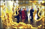 Laura Bush and Ludmila Putin, wife of Russian President Valdimir Putin, are reflected in a gilded mirror as they walk through one of the great halls of Catherine's Palace outside St. Petersburg, Russia. White House photo by Susan Sterner.