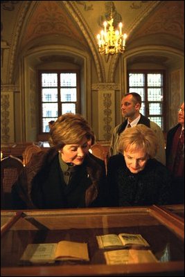 Laura Bush looks over the historic book collection housed at Vilnius University with Alma Adamkiene, wife of the President of Lithuania, Saturday, Nov. 23, 2002. White House photo by Susan Sterner.