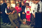 Laura Bush jokes with some children of embassy employees at the American Center in Vilnius, Lithuania Saturday, November 23, 2002. White House photo by Susan Sterner.