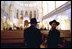 Leaders of the Jewish Community in St. Petersburg, Russia, stand inside the Grand Choral Synagogue while President Bush and Laura Bush tour restoration of the synagogue, the only Jewish house of worship in a city of 4.5 million people.